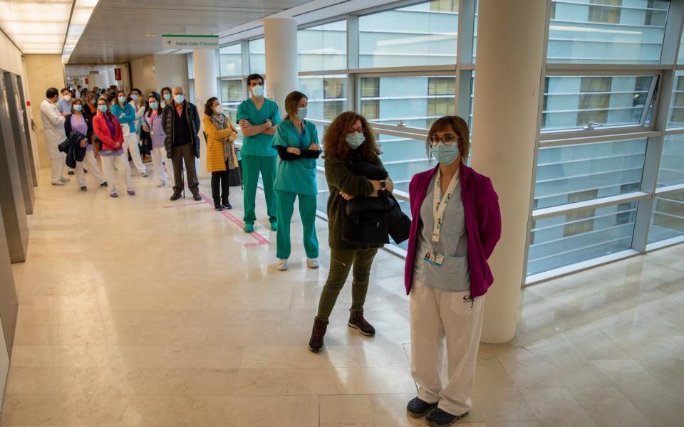 Health care workers queue before receiving a dose of the Pfizer-BioNTech Covid-19 vaccine at Gregorio Maranon Hospital during the third wave of the Coronavirus pandemic - Pablo Blazquez Dominguez/Getty Images Europe