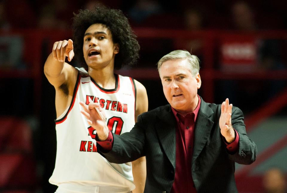 Western Kentucky guard Dalano Banton (20) and head coach Rick Stansbury react during an NCAA college basketball exhibition game against Kentucky Wesleyan, Saturday, Nov. 3, 2018, in Bowling Green, Ky. (Austin Anthony/Daily News via AP)