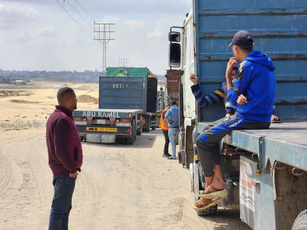 Palestinian truck drivers and United Nations vehicles wait Tuesday near the Rafah crossing on the Gaza side to cross into Egypt after the Israeli army took control of the crossing and announced it would close the route ahead of an assault on Rafah, Gaza.