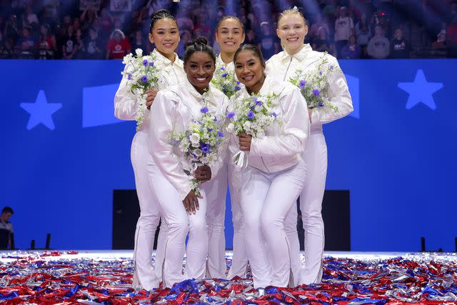 <p>Jamie Squire/Getty</p> Suni Lee, Simone Biles, Hezly Rivera, Jordan Chiles and Jade Carey pose after being selected for the 2024 U.S. Olympic Women's Gymnastics Team on Day Four of the 2024 U.S. Olympic Team Gymnastics Trials