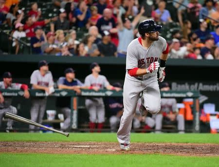 Aug 11, 2018; Baltimore, MD, USA; Boston Red Sox outfielder J.D. Martinez (28) hits a home run in the eighth inning against the Baltimore Orioles at Oriole Park at Camden Yards. Mandatory Credit: Evan Habeeb-USA TODAY Sports