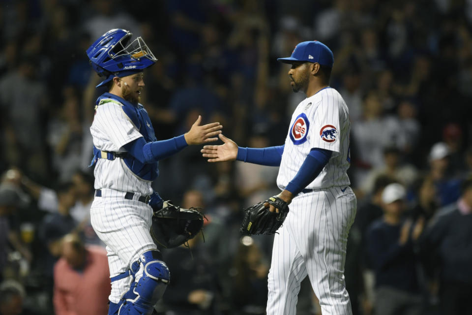 Chicago Cubs closing pitcher Mychal Givens right, celebrates with catcher P.J. Higgins after the Cubs defeated the St. Louis Cardinals 7-5 in a baseball game Thursday, June 2, 2022, in Chicago. (AP Photo/Paul Beaty)