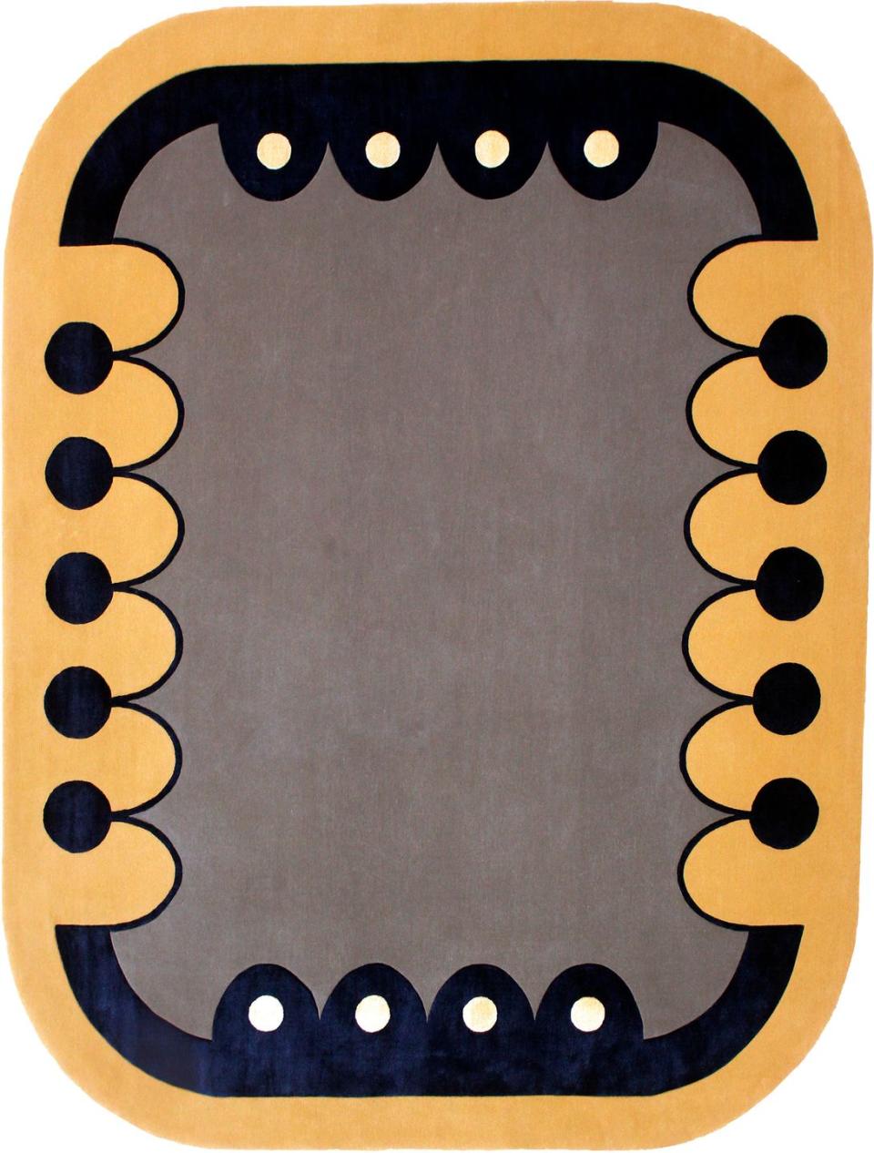 sargeant pepper looking rug in gold border with black accents and a grayish brown interior