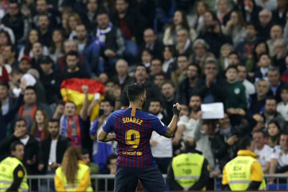 Barcelona forward Luis Suarez celebrates after scoring his side's opening goal during the Copa del Rey semifinal second leg soccer match between Real Madrid and FC Barcelona at the Bernabeu stadium in Madrid, Spain, Wednesday Feb. 27, 2019. (AP Photo/Andrea Comas)