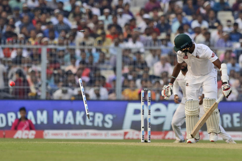 Bangladesh's Ebadot Hossain looks back after being bowled out during the first day of the second test match between India and Bangladesh, in Kolkata, India, Friday, Nov. 22, 2019. (AP Photo/Bikas Das)