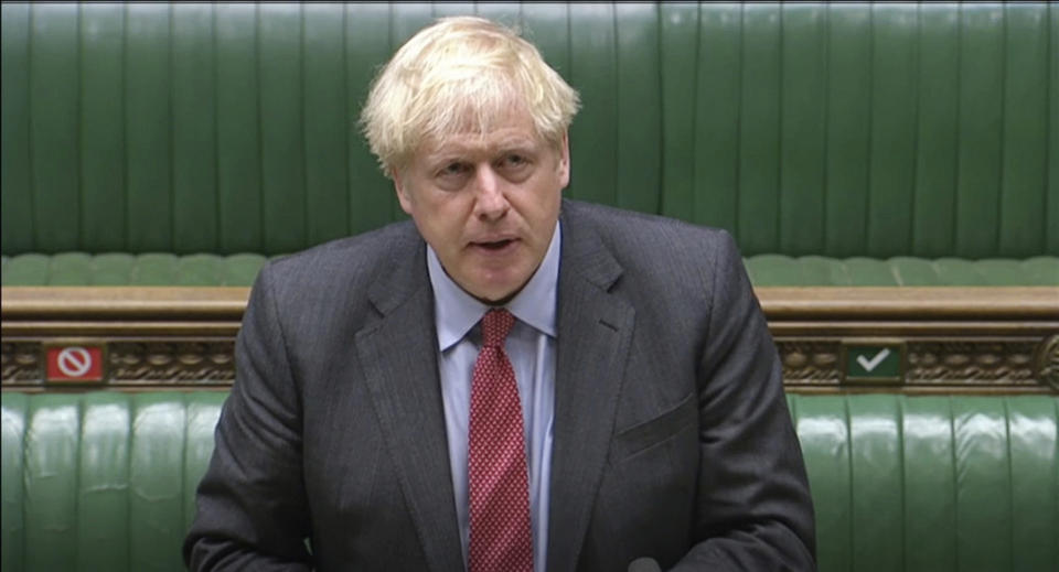 In this grab taken from video, Britain's Prime Minister Boris Johnson makes a statement to MPs in the House of Commons on the latest situation with the coronavirus pandemic in London, Wednesday, Sept. 22, 2020. (Houseof Commons/PA via AP)