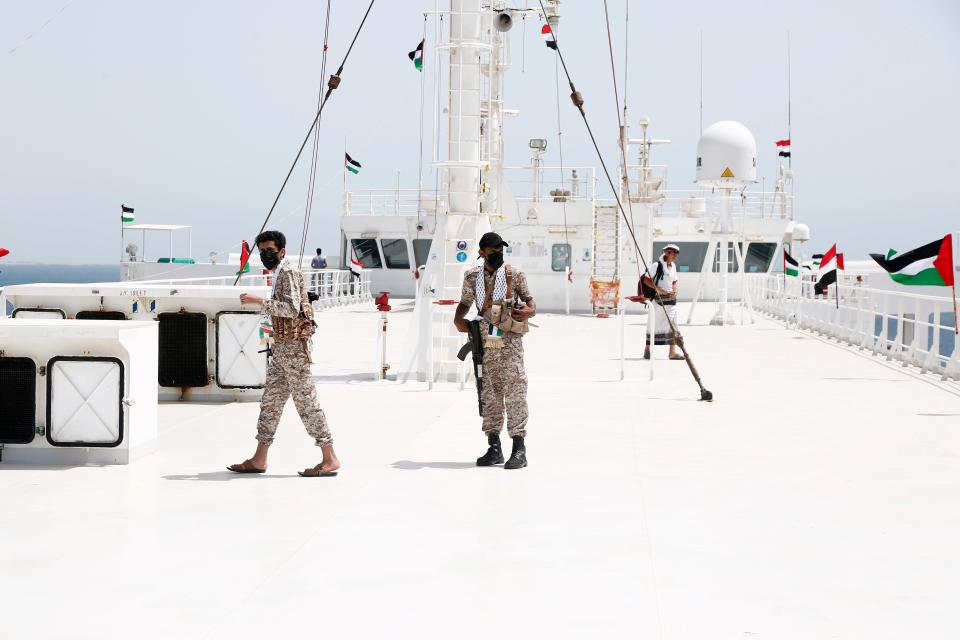 Houthi fighters are seen on the Galaxy Leader, a vessel they hijacked, off the coast of Yemen on May 12, 2024.