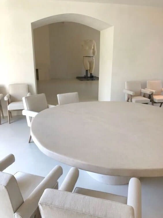 The couple worked with Belgian architect Axel Vervoordt to completely remodel the home, creating a stark, almost-church-like aesthetic, visible in another photo that Kanye shared on Twitter. Asked by <em>Architectural Digest</em> <a href="https://people.com/home/kim-kardashian-west-reveals-how-she-and-kanye-keep-their-white-furniture-safe-from-their-kids/" rel="nofollow noopener" target="_blank" data-ylk="slk:how she keeps the space so pristine;elm:context_link;itc:0;sec:content-canvas" class="link ">how she keeps the space so pristine</a> with three kids in residence, Kim said, “Oh my God. I run around the house with towels. You just have to take a deep breath and say, ‘Ok, it’s going to happen. We decided to have light colors.'”