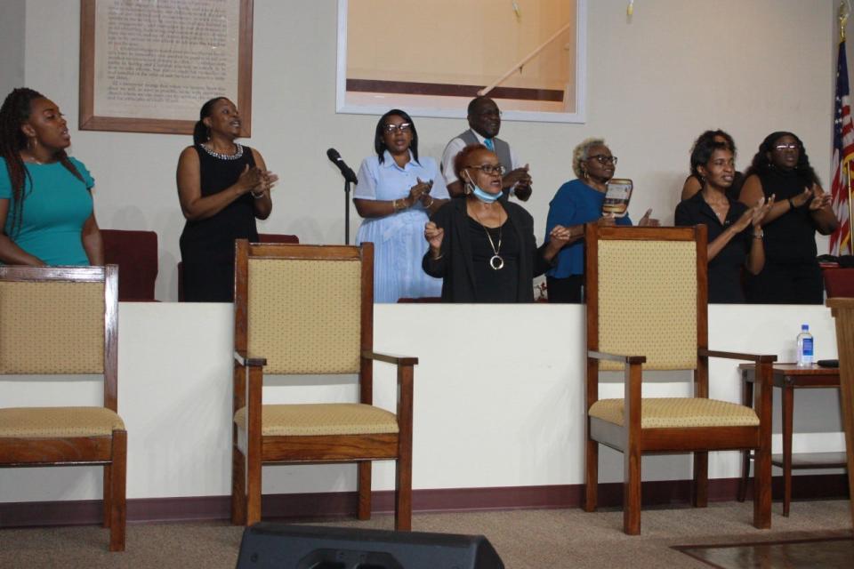 The First Missionary Baptist Church Choir sing during a pastor's anniversary celebration service at the church on Sunday.