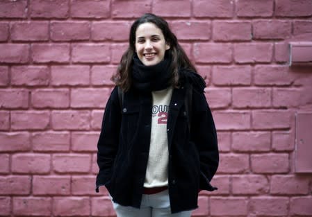 Eva, 18, who voted for the first time in the primary elections, poses in Buenos Aires