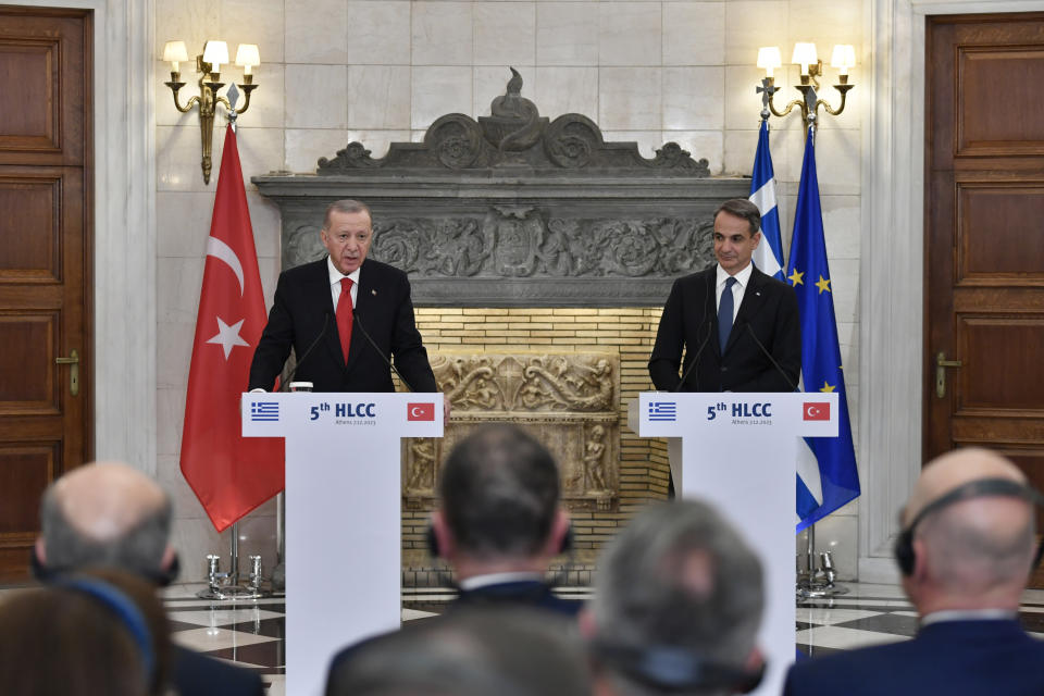 Turkey's President Recep Tayyip Erdogan, left, makes statements with Greece's Prime Minister Kyriakos Mitsotakis after their meeting at Maximos Mansion in Athens, Greece, Thursday, Dec. 7, 2023. Turkish President Recep Tayyip Erdogan is visiting Greece in an effort to mend strained relations and reset ties with Western allies. (AP Photo/Michael Varaklas)