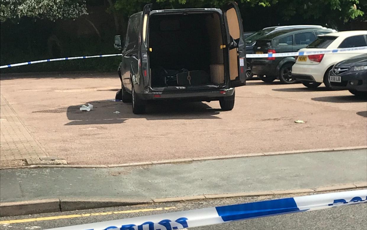 A van involved in the incident surrounded by police tape