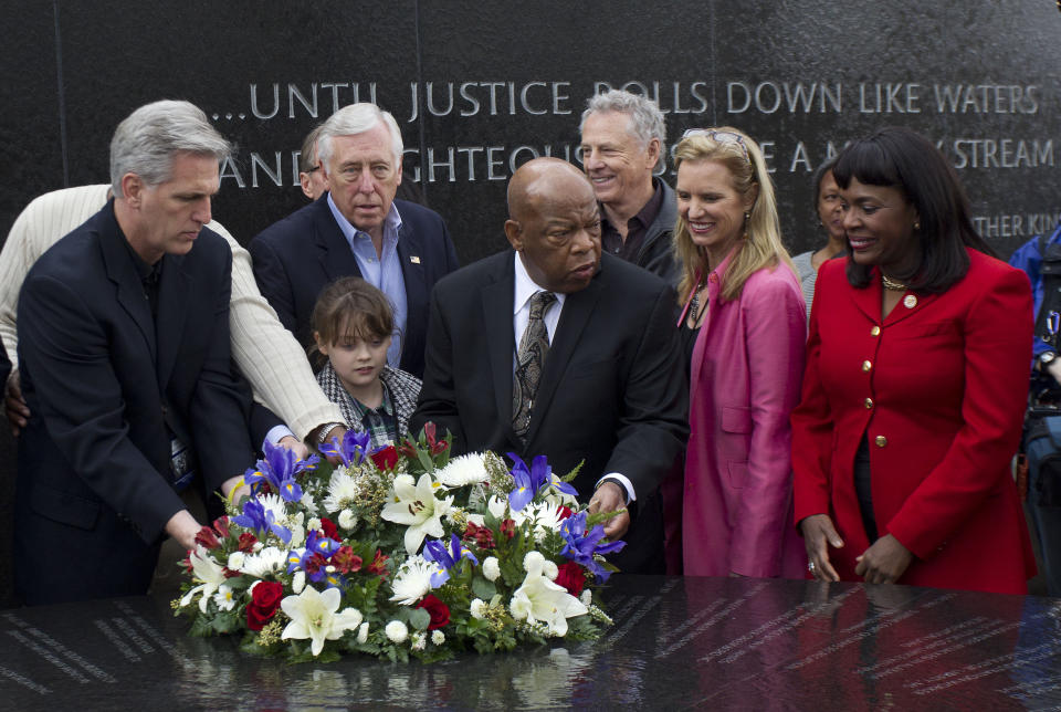 Lawmakers including House Republican Whip Kevin McCarthy, left, of California, House Democratic Whip Steny H. Hoyer, D-Md, (2nd from left), and U.S. Rep. John Lewis, D-Ga., center, place a wreath on the Civil Rights Memorial in Montgomery, Ala., Saturday, March 3, 2012. (Photo: Dave Martin/AP)