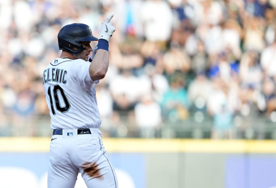 Seattle Mariners' Jarred Kelenic reacts after stealing second base against the New York Yankees during the second inning of a baseball game Monday, May 29, 2023, in Seattle. (AP Photo/Lindsey Wasson)