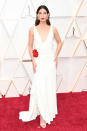 Aldridge looked angelic in a white gown by Ralph Lauren that featured a pop of colour in a red silk rosette at the hip. The model completed the look with diamond and ruby earrings and a bold red lip.