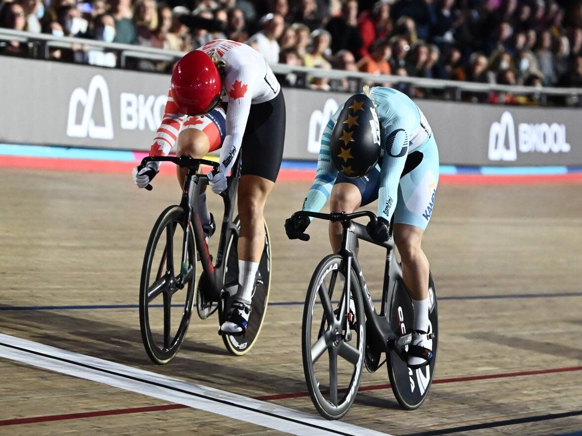 Kelsey Mitchell, left, came second in the women's sprint final at the UCI Track Cycling Champions League, falling to Emma Hinze, right, by just 0.019 seconds in London, England on Saturday. (@UCITCL/Twitter - image credit)
