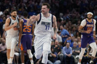 Dallas Mavericks guard Luka Doncic (77) celebrates a score against the Phoenix Suns during the first half of Game 3 of an NBA basketball second-round playoff series, Friday, May 6, 2022, in Dallas. (AP Photo/Tony Gutierrez)