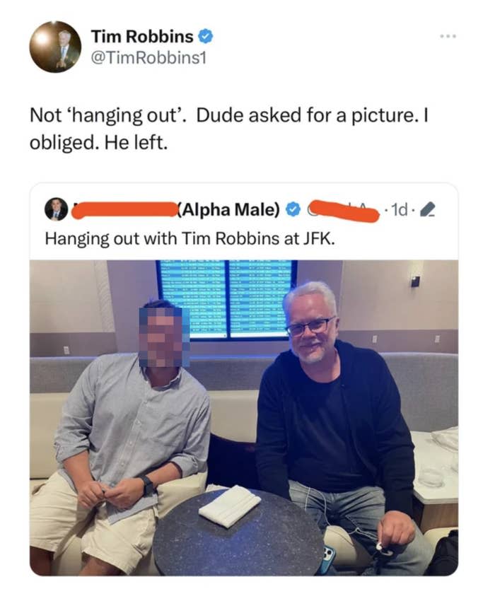 Tim Robbins and a fan seated together, smiling for a photo. Robbins is mentioned as an "Alpha Male" in the overlaid tweet
