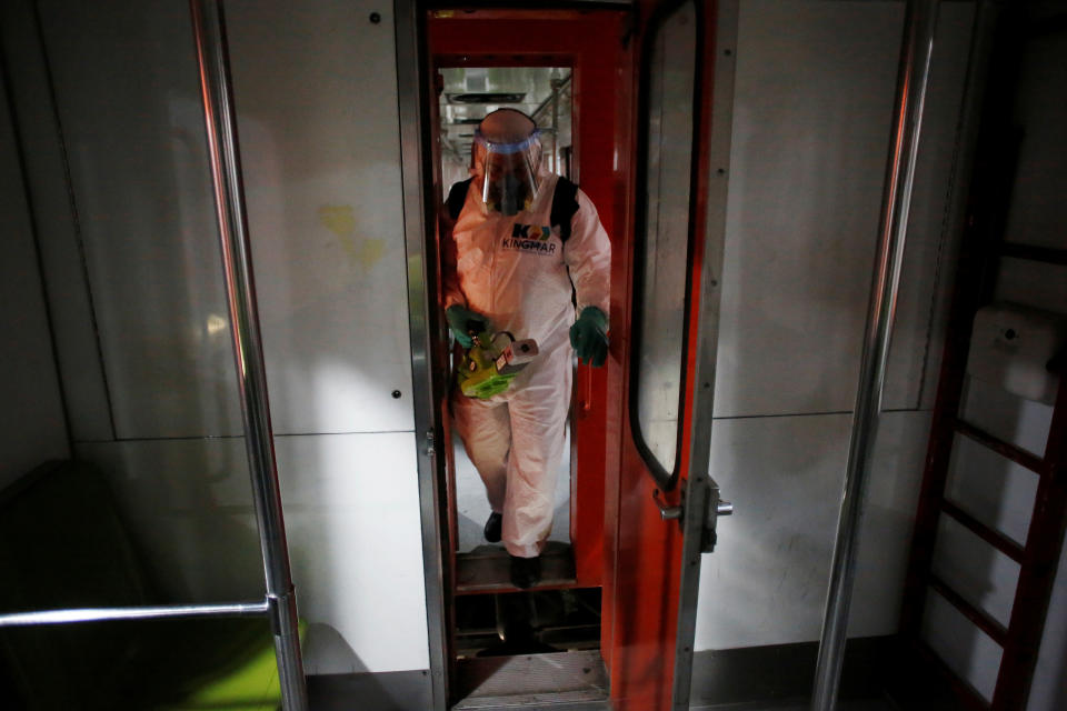 A worker carries out the disinfection of a metro car, as part of Mexico City's government's measures in response to the coronavirus disease (COVID-19), in Mexico City