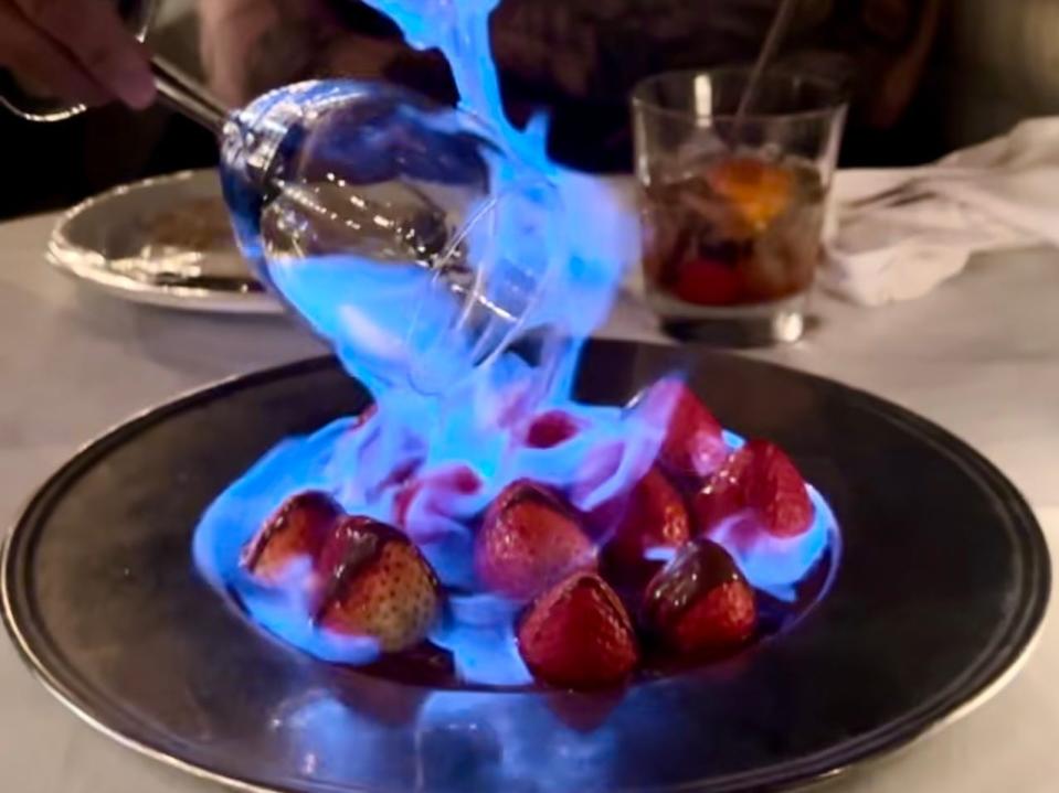 strawberries covered in blue flames