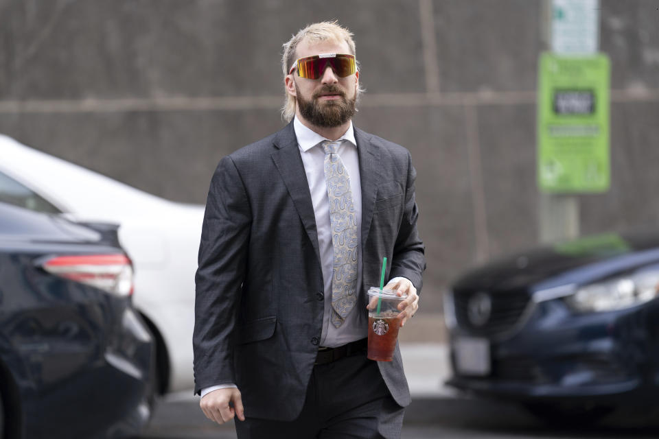 Anthime "Baked Alaska" Gionet, who livestreamed himself storming the U.S. Capitol in Jan. 6, arrives at federal court in Washington, Tuesday, Jan. 10, 2023. (AP Photo/Jose Luis Magana)