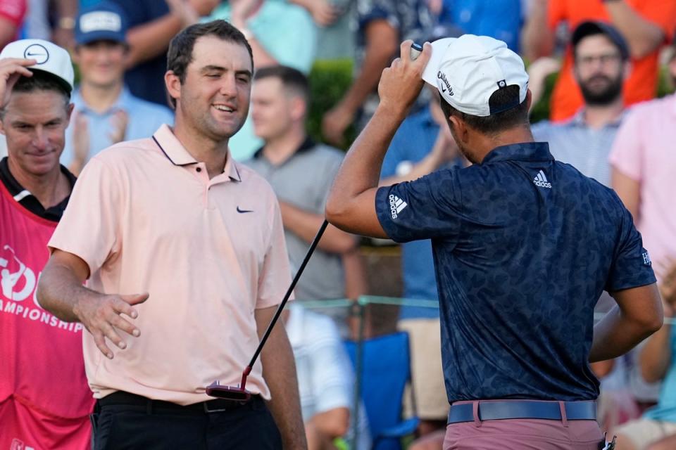 Scottie Scheffler (left), speaks with Xander Schauffele after their second round of the Tour Championship (Steve Helber/AP) (AP)