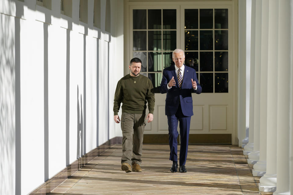 President Joe Biden and Ukrainian President Volodymyr Zelenskyy walk along the Colonnade of the White House, Wednesday, Dec. 21, 2022, in Washington. (AP Photo/Patrick Semansky)