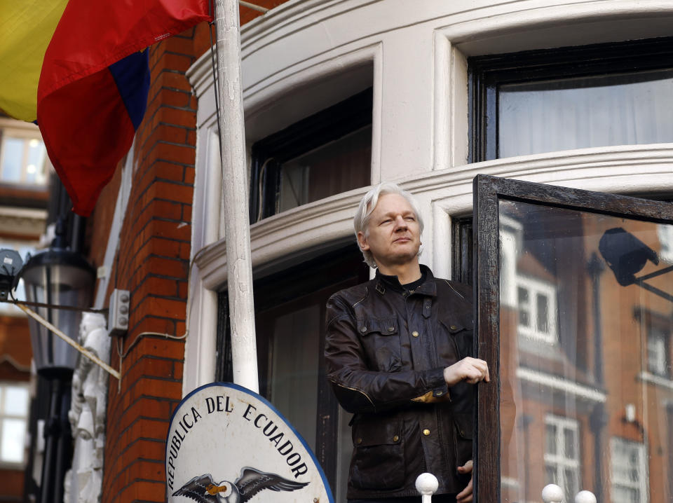 FILE - In this Friday, May 19, 2017 file photo, Julian Assange greets supporters outside the Ecuadorian embassy in London. London police say they've arrested WikiLeaks founder Julian Assange at the Ecuadorian embassy, it was reported on Thursday, April 11, 2019. (AP Photo/Frank Augstein, File)