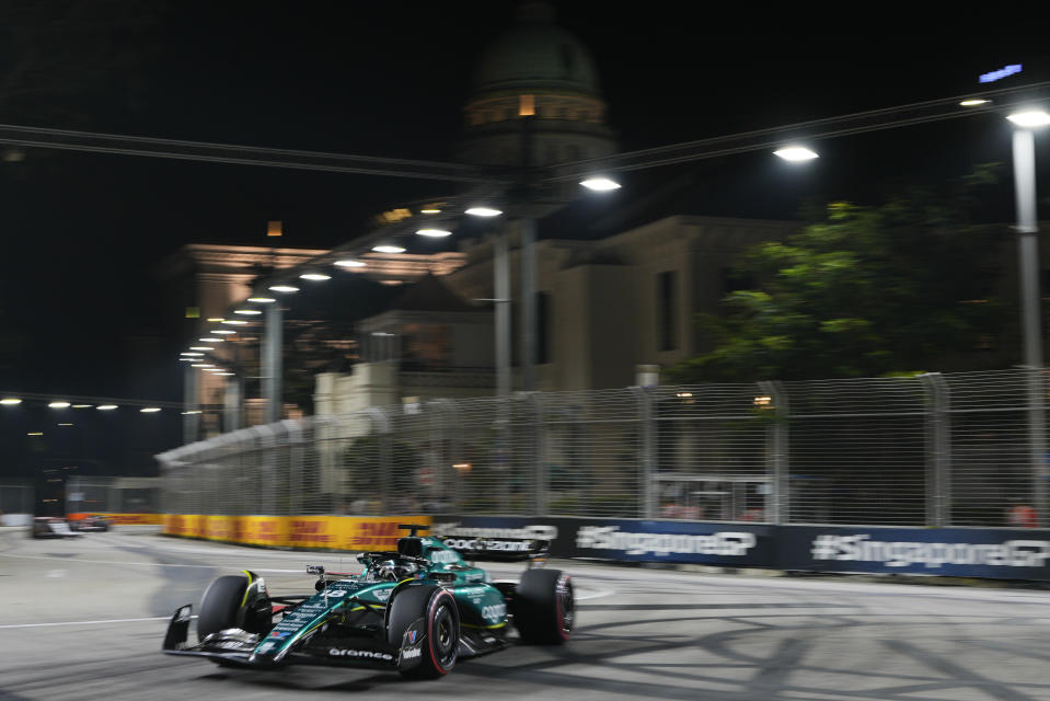 Aston Martin driver Lance Stroll of Canada steers his car during the second practice session of the Singapore Formula One Grand Prix at the Marina Bay Street Circuit, Singapore,Friday, Sept. 15, 2023. (AP Photo/Vincent Thian)