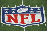 FILE - The NFL logo is seen at a stadium on Nov. 2, 2020, in East Rutherford, N.J. Hundreds of Black NFL retirees denied payouts in the $1 billion concussion settlement now qualify for awards after their tests were rescored to eliminate racial bias. Changes to the settlement made last year are meant to make the tests race-blind. (AP Photo/Adam Hunger, File)