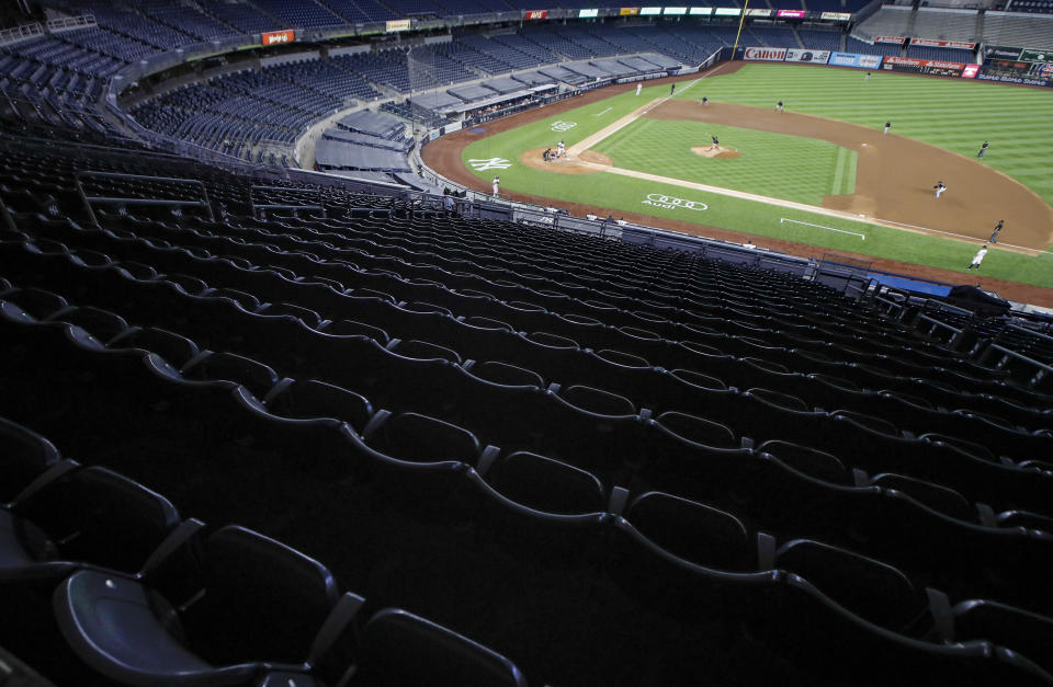 Stands are empty of spectators in the fourth inning of a baseball game between the New York Yankees and the Boston Red Sox, Saturday, Aug. 1, 2020, in New York. (AP Photo/John Minchillo)