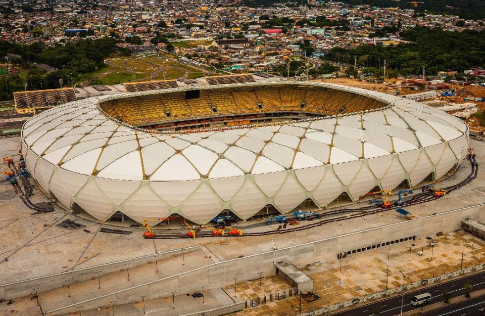 This photo released by Portal da Copa shows Arena da Amazonia stadium on the day of its inauguration in Manaus in the state of Amazonas, Brazil, Sunday, March 9, 2014. Three stadiums still have to be finished, including the one hosting the opener in Sao Paulo in about three months. (AP Photo/Jose Zamith, Portal da Copa)