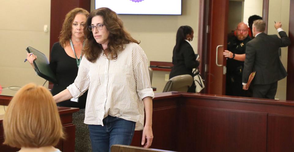 Joan Naydich walks with her lawyer as Brendan Depa is escorted back to the holding cells, March 9, 2023 following a hearing before Judge Chris France, at the Kim C. Hammond Justice Center in Bunnell, where Naydich sought a permanent injunction against the Matanzas High School student accused of attacking her.