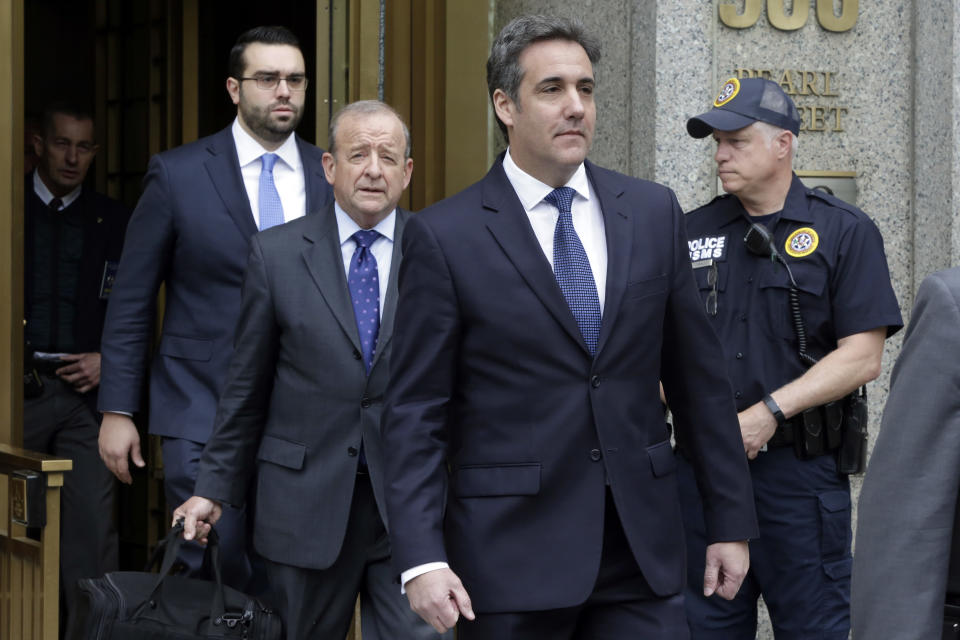 Michael Cohen, right, leaves federal court in New York on Wednesday. Cohen’s attorney Stephen Ryan is immediately behind him. (Photo: Richard Drew/AP)