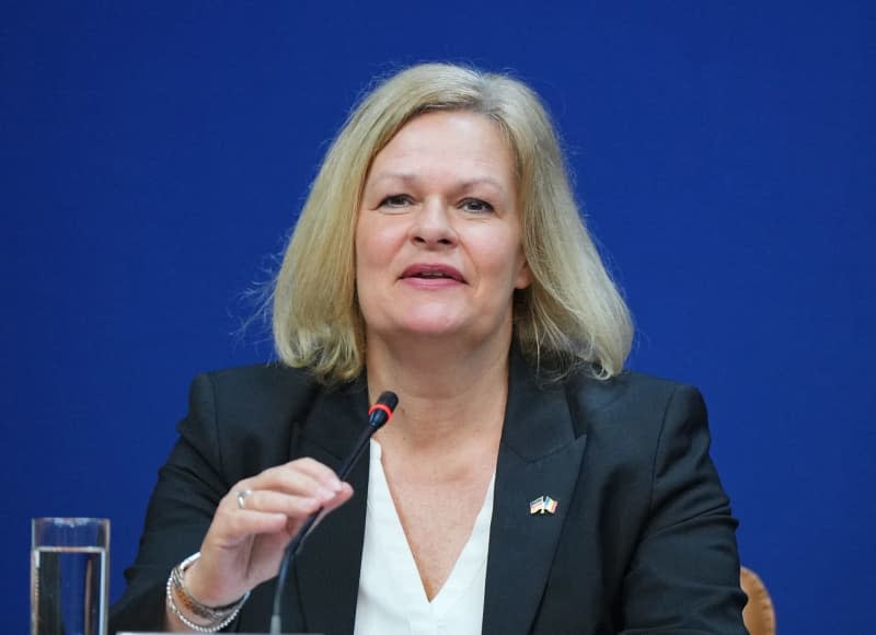 Nancy Faeser, Germany's Interior Minister, speaks during a joint press conference with Romanian Deputy Prime Minister and Interior Minister Predoiu and former professional footballer Hitzlsperger, German ambassador for UEFA Euro 2024. Soeren Stache/dpa