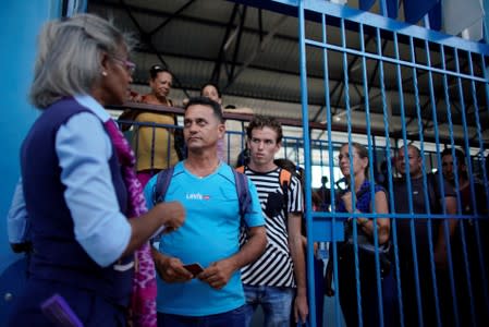 Passengers get ready to embark on Cuba's Chinese-made first new passenger train cars at La Coubre train station in Havana