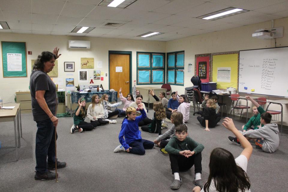 Retired Overlook Middle School physical education teacher, Doris Matthews, guides the students through several Native American children's games. She said she has been involved with Native American Day for many years before she retired in 2019 and hopes to continue helping with the day.