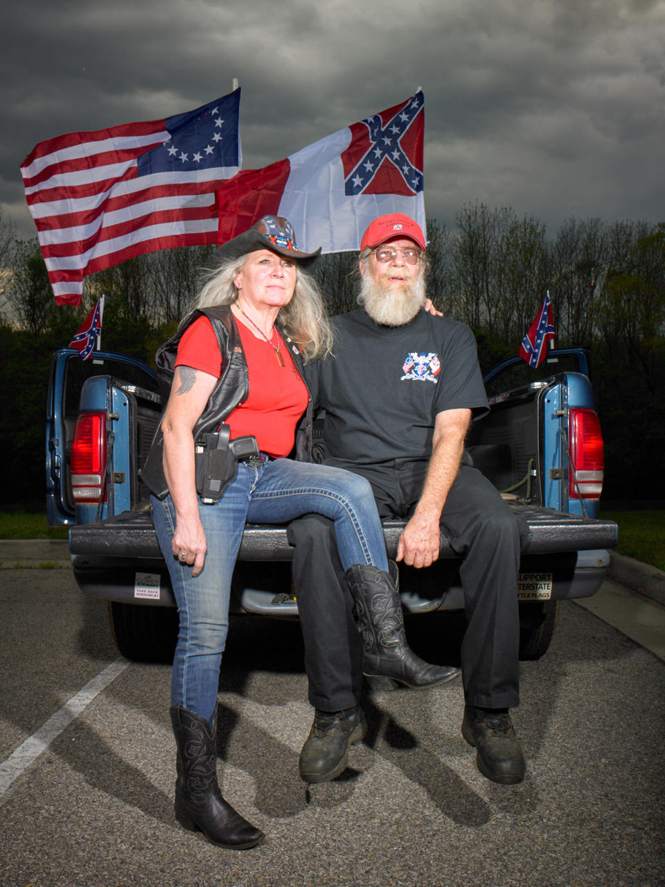 <p>“Wayne Byrd, president of the Heritage Preservation Association, and his wife, Susan. The group gathers every Saturday outside the Danville Museum of Fine Arts and History to protest its removal of the Third National Flag of the Confederacy, a gift from the association. They voted for Trump.” (Photograph and caption by Naomi Harris) </p>