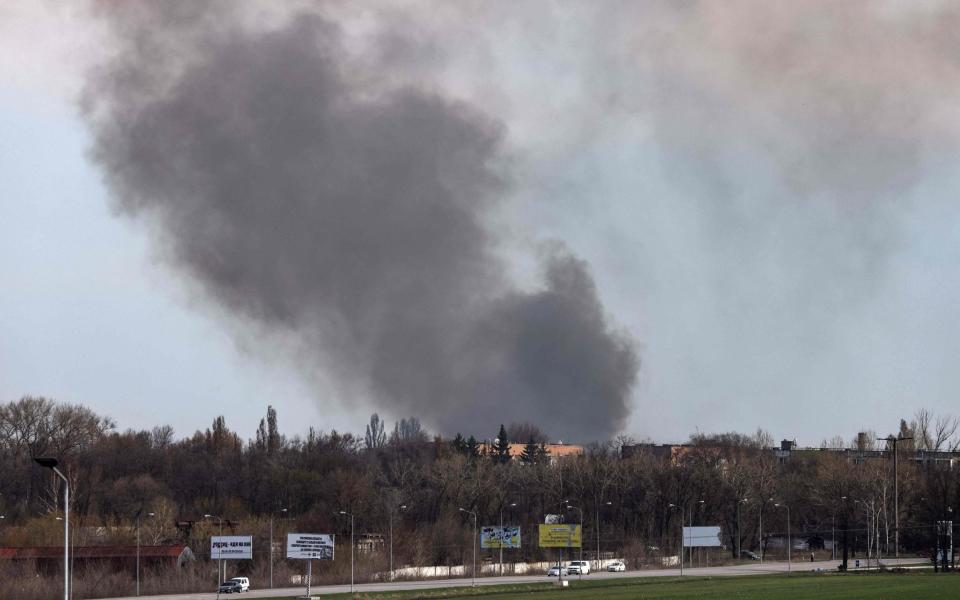 Smoke rises from the airport of Dnipro - RONALDO SCHEMIDT/AFP