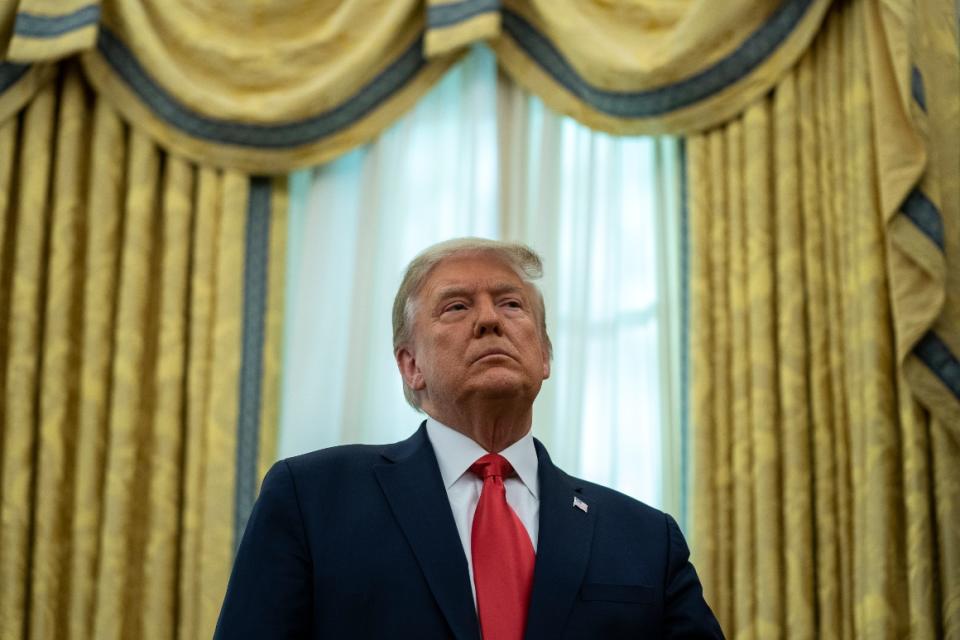 President Donald Trump listens during a ceremony to present the Presidential Medal of Freedom Thursday, Dec. 3, 2020.