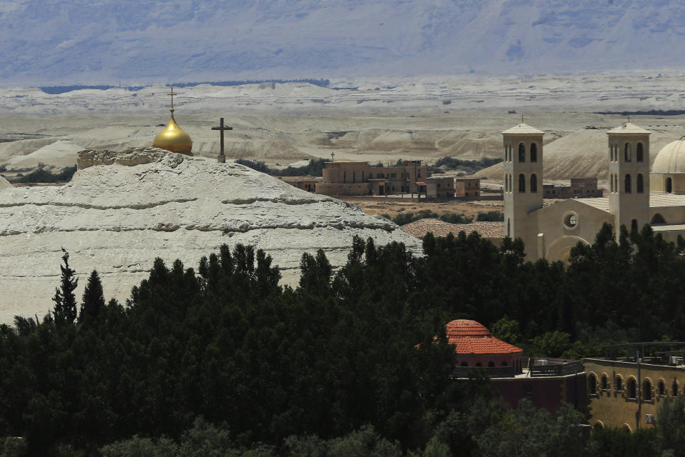 Buildings stand at Al-Maghtas, known as Bethany Beyond the Jordan, on the east bank of the Jordan River in Jordan on Wednesday, June 8, 2022. (AP Photo/Raad Adayleh)