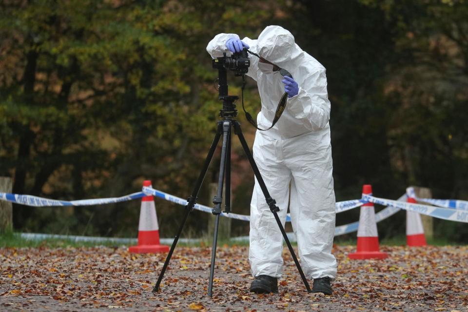 Forensic investigators at Watlington Hill in Oxfordshire (PA)
