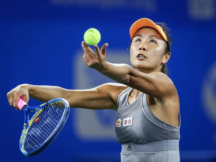 Shuai Peng of China severs during the match against Garbine Muguruza of Spain on Day 2 of 2019 Dongfeng Motor Wuhan Open