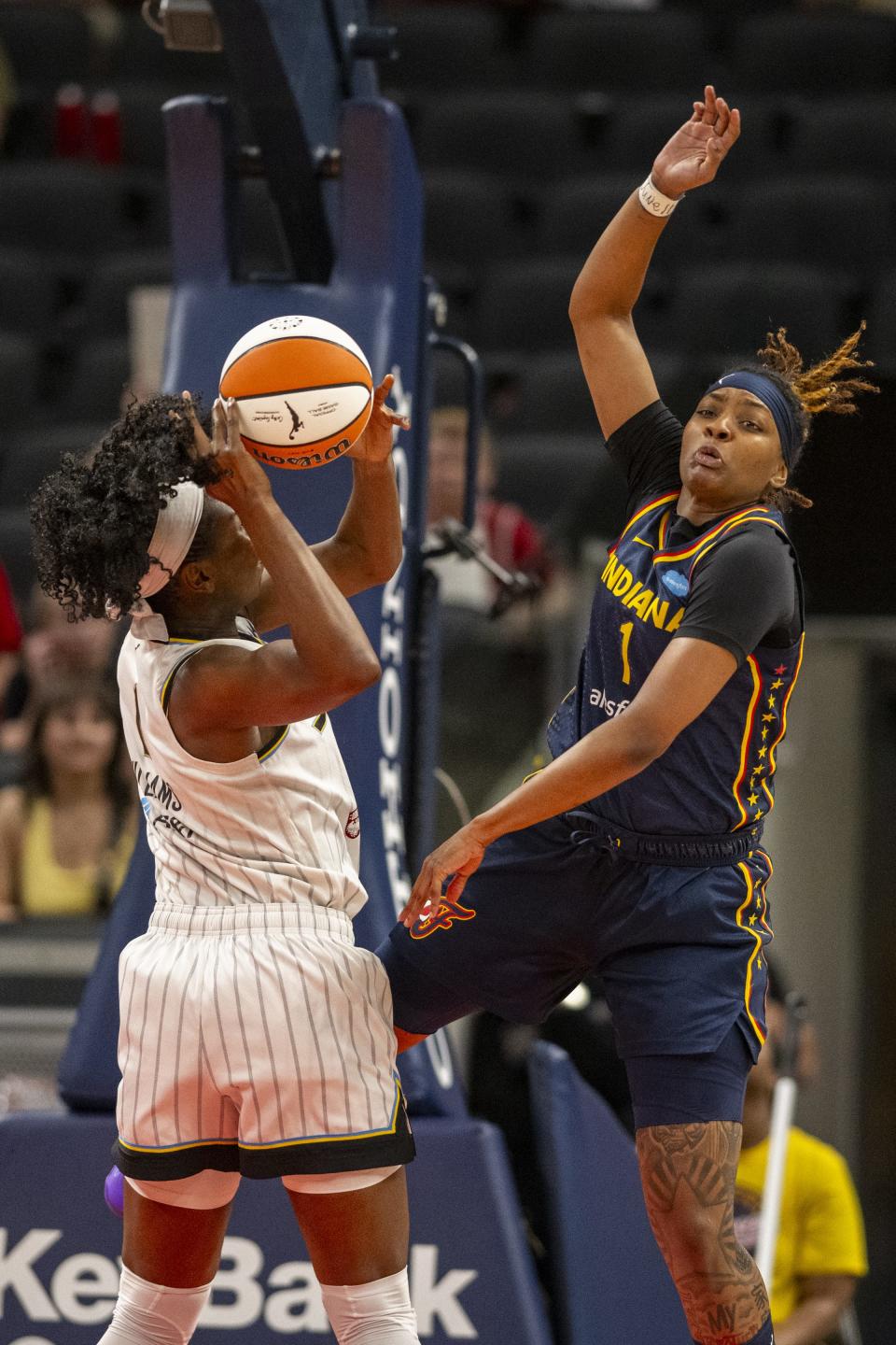 Indiana Fever forward NaLyssa Smith (1) attempts to block a shot by Chicago Sky center Elizabeth Williams (1) during the first half of an WNBA basketball game, Sunday, July 2, 2023, at Gainbridge Fieldhouse in Indianapolis.