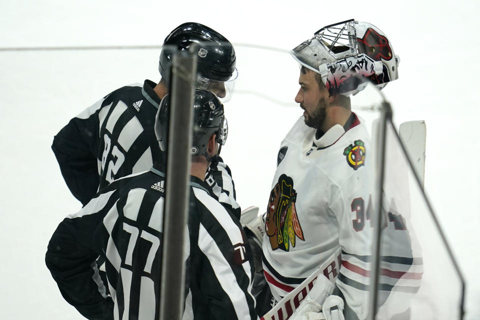 Chicago Blackhawks goaltender Petr Mrazek talks with referees during the second period of an NHL hockey game against the Minnesota Wild, Sunday, Dec. 3, 2023, in St. Paul, Minn. (AP Photo/Abbie Parr)