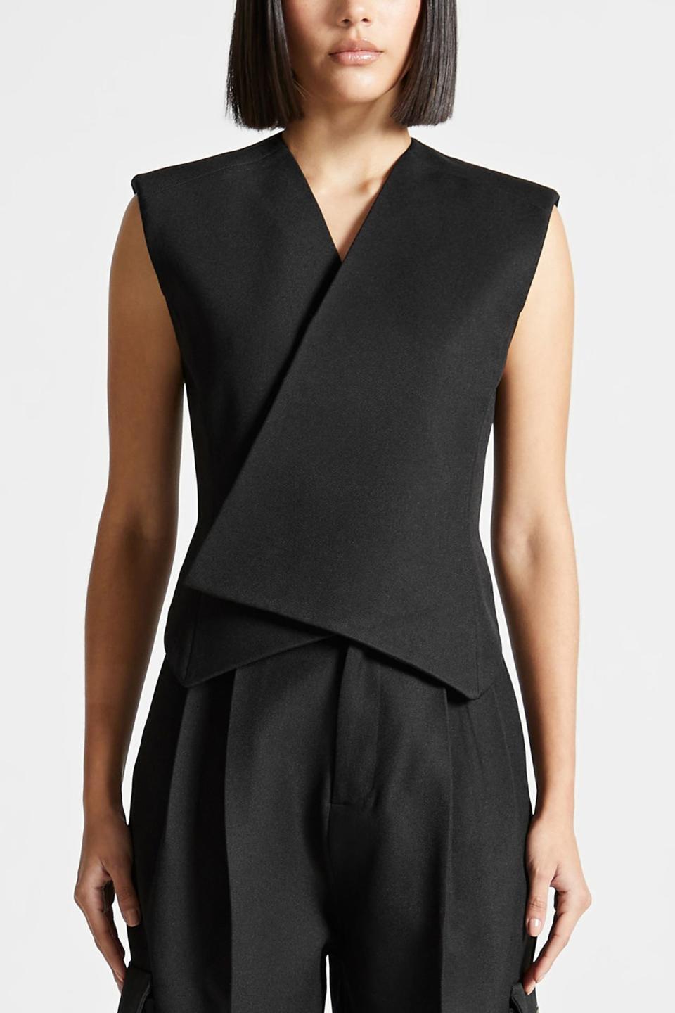 <p><a href="https://us.manieredevoir.com/products/tailored-wrap-waistcoat-black" rel="nofollow noopener" target="_blank" data-ylk="slk:Shop Now;elm:context_link;itc:0;sec:content-canvas" class="link ">Shop Now</a></p><p>Tailored Wrap Waistcoat </p><p>$95.00</p><p>manieredevoir.com</p>