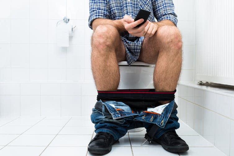 <span class="caption">Up to 75% of people use their phone on the toilet.</span> <span class="attribution"><a class="link " href="https://www.shutterstock.com/download/success?u=http%3A%2F%2Fdownload.shutterstock.com%2Fgatekeeper%2FW3siZSI6MTUyNzAyNzAyNSwiYyI6Il9waG90b19zZXNzaW9uX2lkIiwiZGMiOiJpZGxfMjQ2NzEzNjQxIiwiayI6InBob3RvLzI0NjcxMzY0MS9odWdlLmpwZyIsIm0iOjEsImQiOiJzaHV0dGVyc3RvY2stbWVkaWEifSwieG9aSXpBNyt5YWlTVlRxRm9hbk8zbVRhMUlnIl0%2Fshutterstock_246713641.jpg&pi=33421636&m=246713641&src=FFiW_UE5-dA665Qzal7nUw-1-32" rel="nofollow noopener" target="_blank" data-ylk="slk:Shutterstock;elm:context_link;itc:0;sec:content-canvas">Shutterstock</a></span>