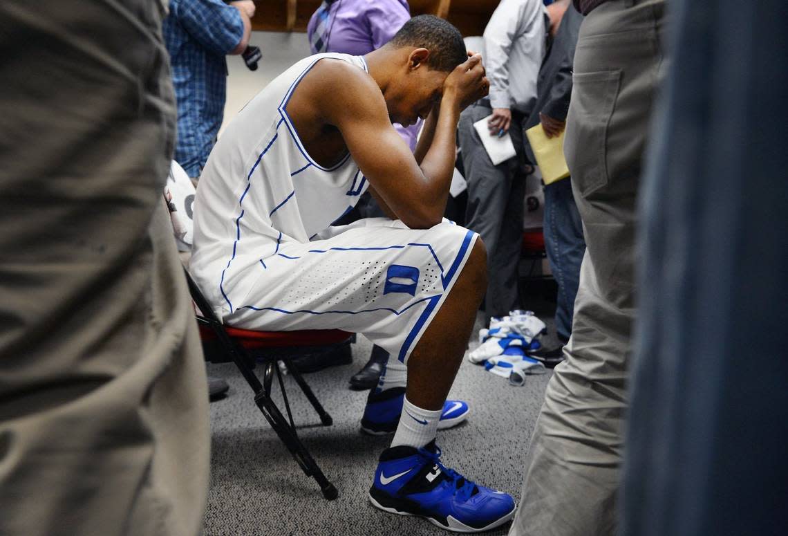 Members of the media mill around Duke forward Rodney Hood (5) in the locker room after the Blue Devils were upset by Mercer 78-71 in their opening game of the NCAA Men’s Basketball Tournament at the PNC Arena in Raleigh, N.C. Friday, March 21, 2014.