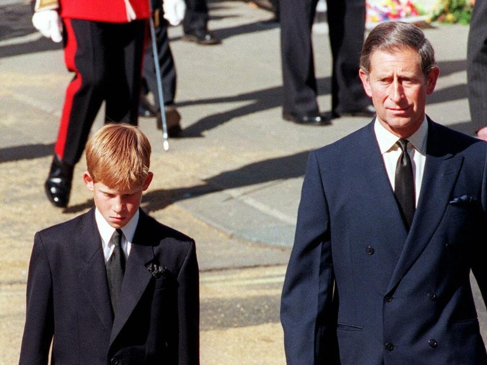 Prince Harry walks between his uncle Earl Spencer and his father, King Charles, at Princess Diana's funeral in 1997.