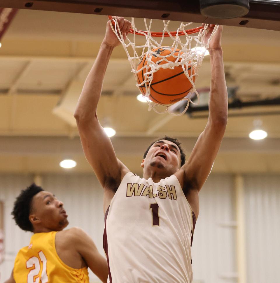 Walsh's Tim Smith Jr. dunks against Missouri-St. Louis in an NCAA Division II Tournament game last season.